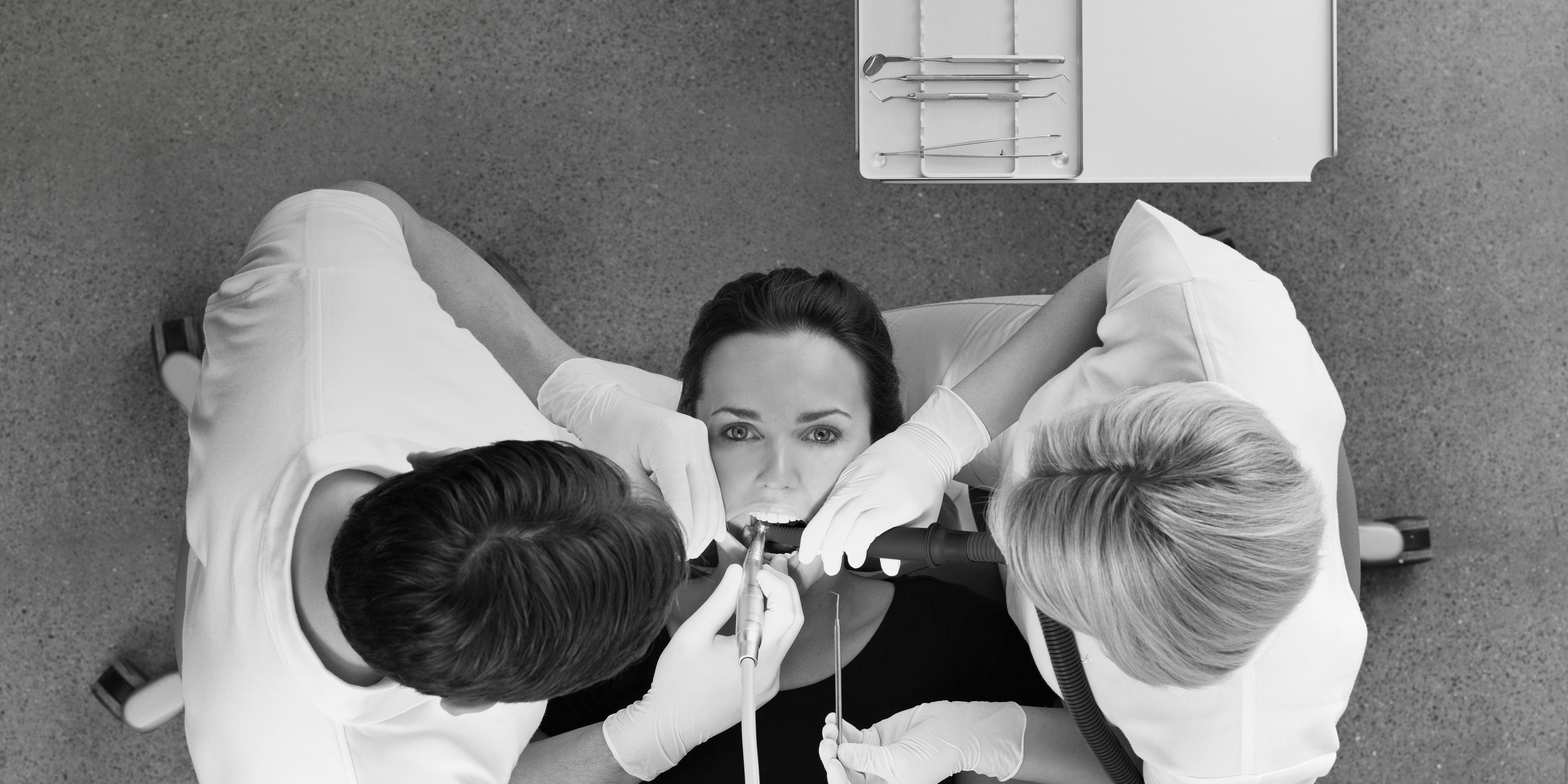 Dental team working efficiently with over the patient instrument delivery system
